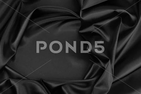 Closeup of rippled black silk fabric Stock Photos