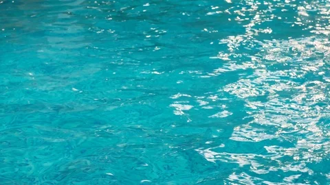 Closeup of the ripples and reflection on clean blue water in a swimming pool Vidéo 110468916