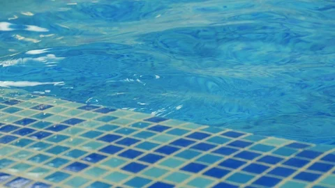 Closeup of the ripples and reflection on clean blue water in a swimming pool Stock Footage 110469002
