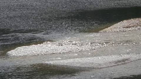 Closeup on the River Flowing into the Mountain Lake Stockbeeldmateriaal 81410522