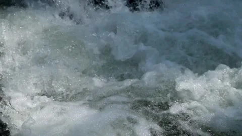 Closeup of river water cascade with clear,clear water flowing fast between rocks Stock Footage 292666720