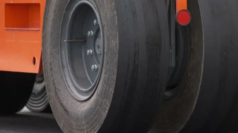 Closeup of Road rollers wheels Heavy industrial machinery working on road. Stock-Footage 133107656