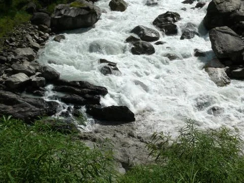 Closeup of a roaring river in Himalayas Fotos Stock