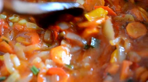 Closeup roasted carrots, vegetables, mixed wooden spatula Stock Footage 49092571