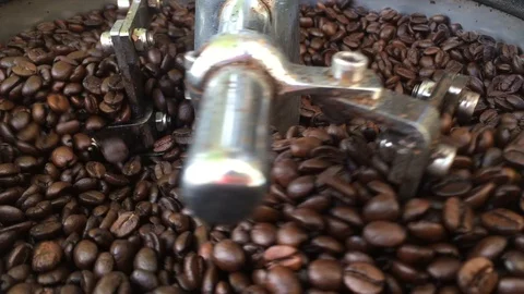 Closeup of roasted coffee beans after roasting in a drum type coffee roaster. Stock Footage 101222340