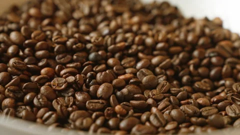 Closeup of roasted coffee beans creating a textured pattern, highlighting t.. Stock Footage 296902470