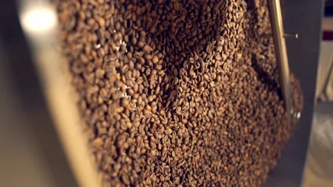 Closeup of roasted coffee beans inside roaster Vídeos de archivo 170696991