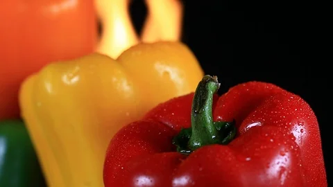 Closeup of Roasting Bell Peppers with Fire - Shallow Depth of Field Stock Footage 104078181