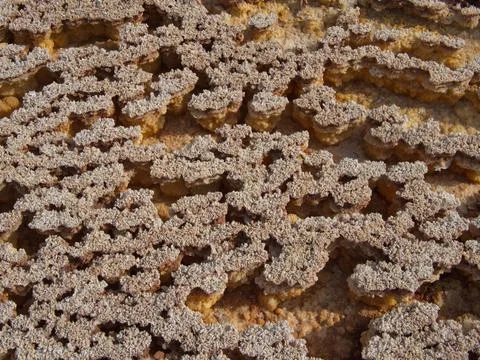 Closeup of rock patterns forming a background Mars like landscape in Danakil Stock Photos