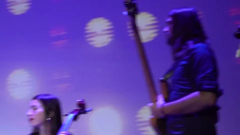 Closeup rockstar on stage playing an electro bass guitar. Male guitarist. Kyiv Stock Footage 220806359