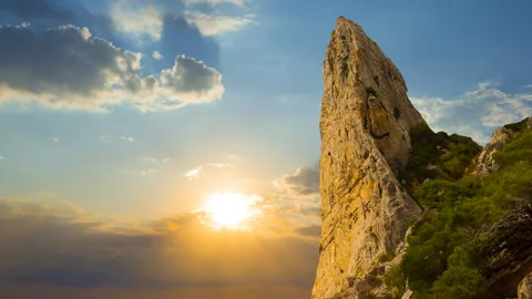 Closeup rocky mount top on dramatic sunset background Stock Footage 257605892