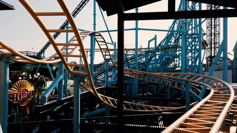 Closeup of roller coaster during warm summer day Stock Footage 111081114