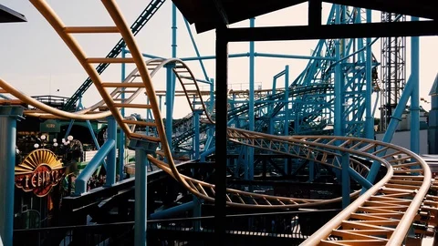 Closeup of roller coaster during warm summer day Stock Footage 111081156