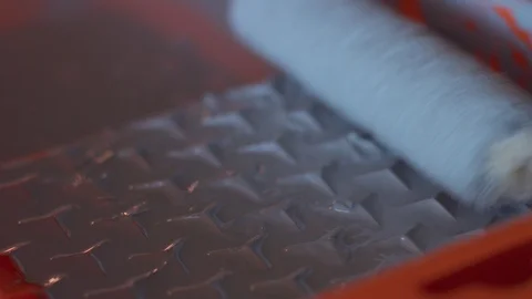 Closeup of roller take of paint exess Stock Footage 102381699