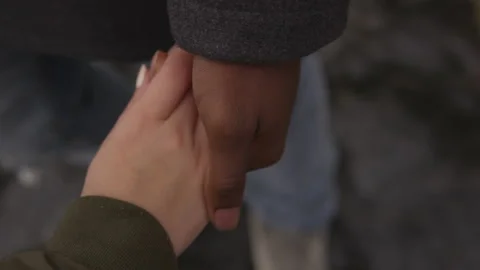 Closeup of a Romantic Couple Holding Hands While at the Beach Stock Footage 208746437