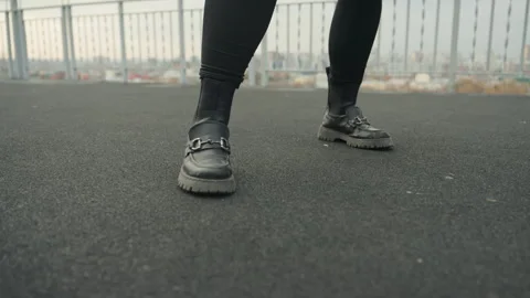 Closeup of rooftop dance. Solo dancer executing rhythmic steps outdoors. Dancer Video stock 334949941