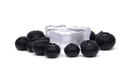 Closeup of rotating blueberries isolated on the white background. Stock Footage 158533763