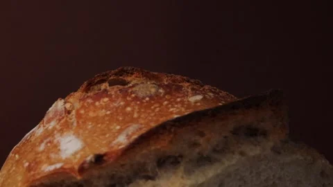 Closeup rotating crispy golden bread crust with detailed texture and bubbles on Stock Footage 311511626