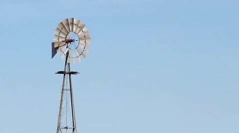 Closeup to a rotating metallic windmill Stock Footage 43477870