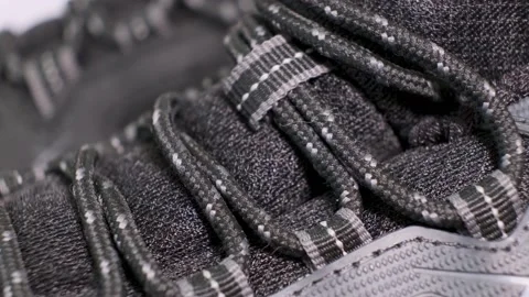 Closeup of rotating pair of black tracking boots with laces. Stock Footage 140467347