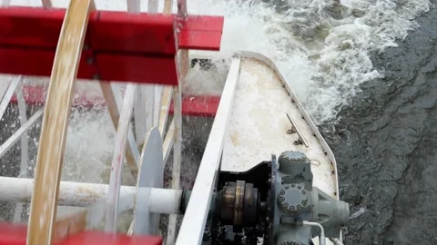 Closeup of rotating red paddle wheel of a cruise boat in motion. Stock Footage 202146954