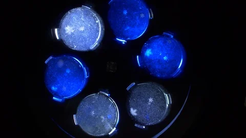 Closeup rotating snowflake projector, phantom blue color Stock-Footage 122979609