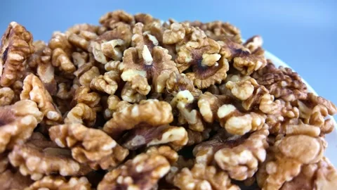 Closeup of rotating walnuts showing texture in natural light Stock Footage 331583980