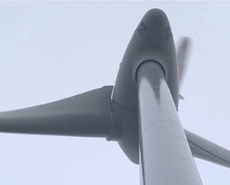 Closeup of rotating windmill propeller wings shot from behind. Stock Footage 8973063