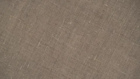 Closeup rotation durable burlap fabric. rough texture natural fabric. top view. Stock Footage 255297421