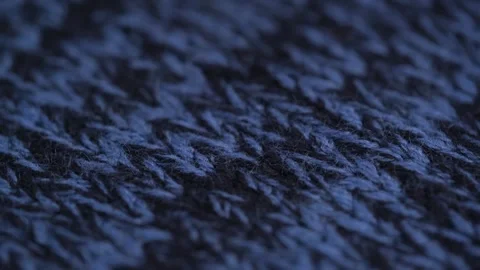 Closeup rotation texture of soft woolen material of light and dark blue color. Stock Footage 252159040