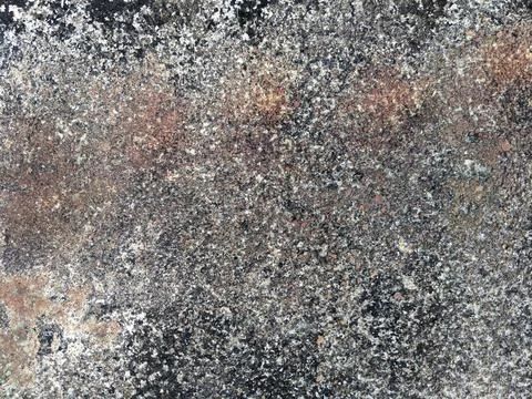 Closeup of the rough surface of a cement wall that has been abandoned for a long Stock Photos