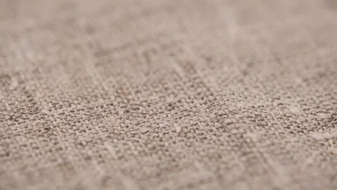 Closeup rough texture natural burlap with plain weave fabric threads. rotation. Stock Footage 256298774