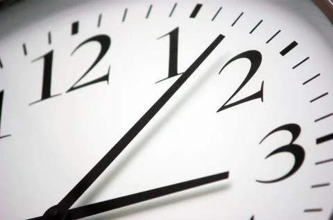 Closeup of round black and white clock Stock Photos