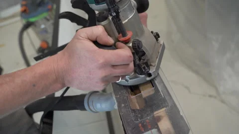 Closeup of a router for installing hidden hinges of interior doors Stock Footage 264142400