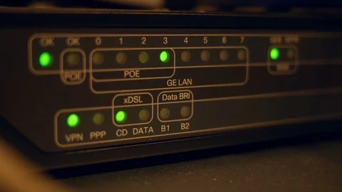 Closeup of a router with lan cables plugged and led lights blinking. Stock Footage 123568061
