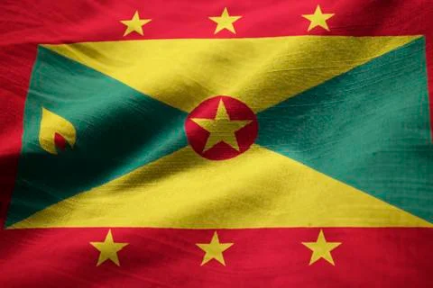 Closeup of Ruffled Grenada Flag, Grenada Flag Blowing in Wind Stock Photos