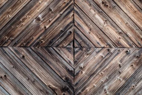 Closeup of a rustic aged wood wall background with decorative woodwork design Stock Photos