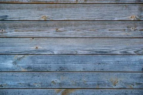 Closeup rustic wooden desk wall. background with nice texture with blue, red  Stock Photos