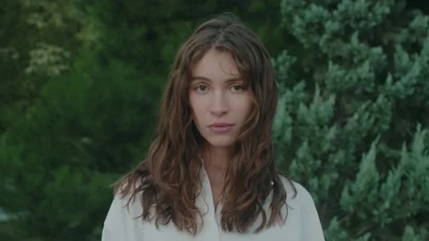 Closeup sad brooding man's face caucasian young single woman. Looks into the Stock Footage 220346363