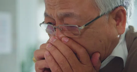 Closeup of sad elderly Asian man patient showing stress during consult. Vídeos de archivo 347229966