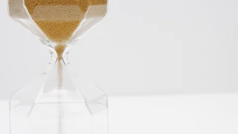 Closeup of a sand clock on the left side with space on the right side Stock Footage 116335304