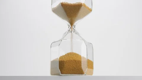 Closeup of a sand clock in studio. minimalistic video about time concept Stock Footage 116333613