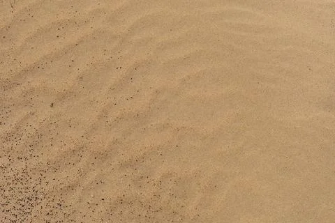 Closeup of sand pattern of a beach or desert Stock Photos