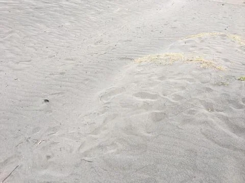 Closeup of sand pattern of a beach in the summer Stock Photos