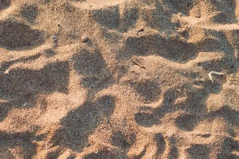 Closeup of sand pattern of a beach in the summer Stock Photos