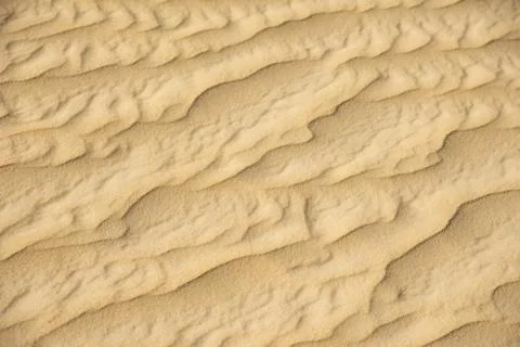 Closeup of sand pattern of beach in summer Stock Photos