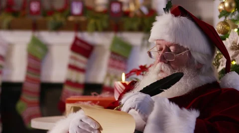 Closeup, Santa Claus writing on list Stock Footage