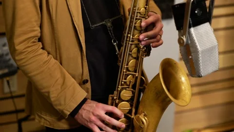 Closeup of Saxophonists in Recording Studio Stock Footage 258091955
