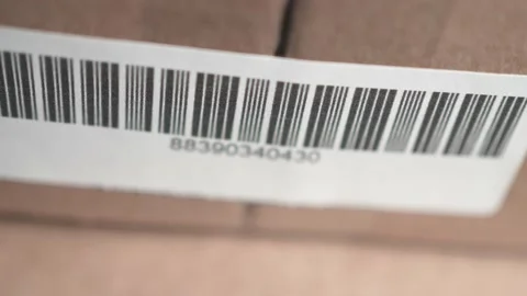 Closeup Scanning a Bar Code Label With a Red Laser Stock Footage 185117682