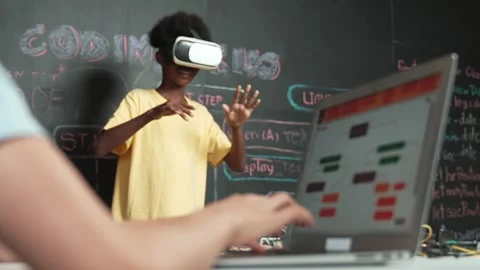 Closeup of school girl hand coding program while student using VR. Edification Stock Footage 276147765